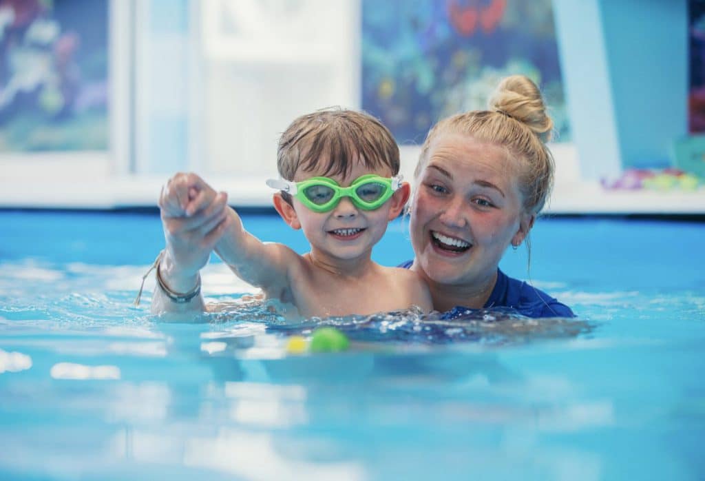 Instructor and Child Wearing Goggles at SwimKids Utah